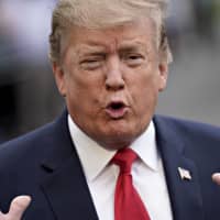U.S. President Donald Trump speaks to members of the media before boarding Marine One on the South Lawn of the White House in Washington on Friday. Trump said the U.S. never paid &#36;2 million medical bill to North Korea to secure the June 2017 release of American college student Otto Warmbier. | BLOOMBERG