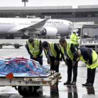 The body of Kaori Takahashi, a Japanese woman killed in the terrorist bombings in Colombo, arrives at Narita airport on Thursday. | KYODO