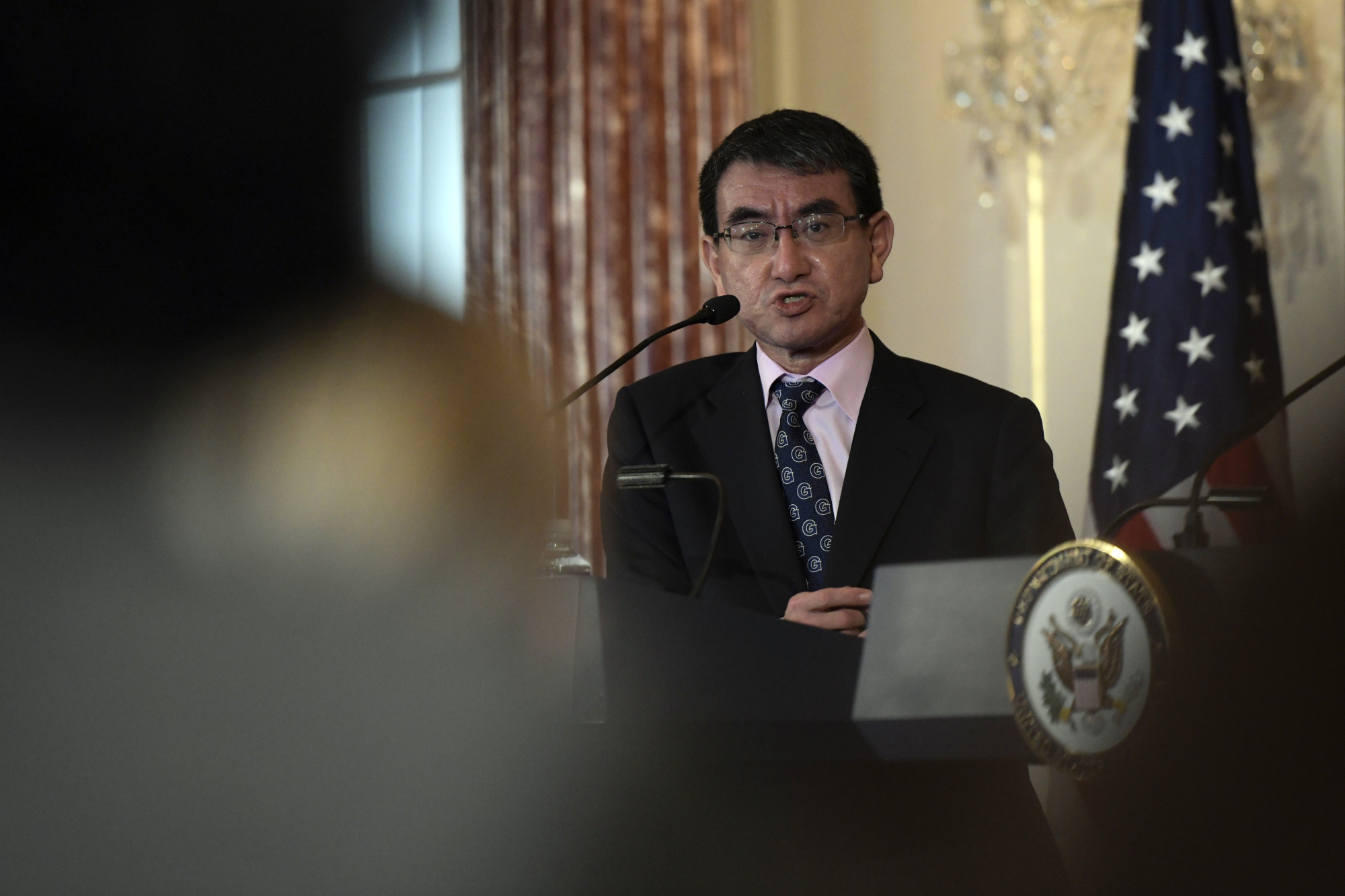 Japanese Foreign Minister Taro Kono answers a question during a news conference Friday at the Department of State in Washington. | AP