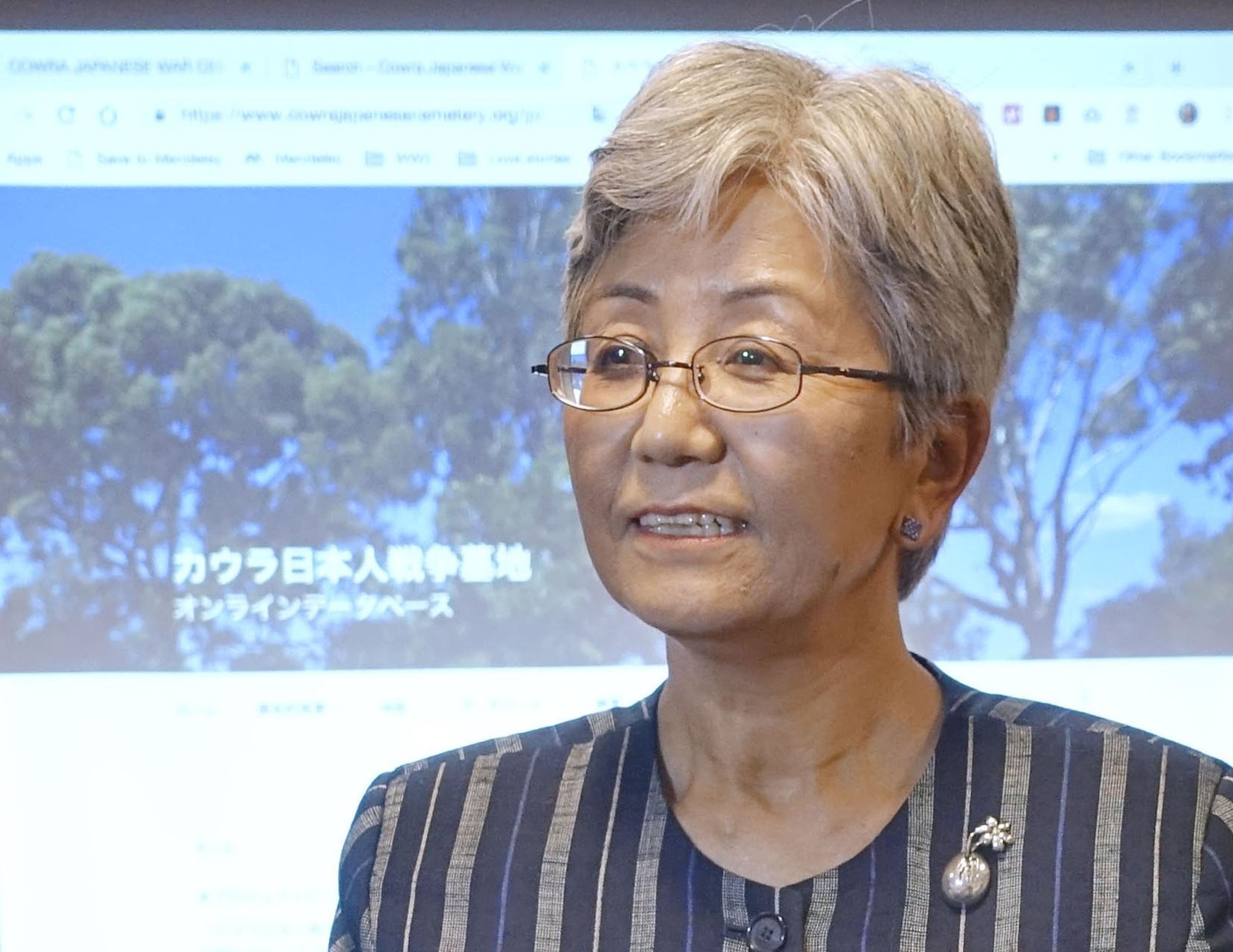 Keiko Tamura of Australian National University speaks during a news conference at the Japanese Embassy in Canberra to announce that a bilingual database of Japanese nationals who died and were buried in Australia has been created. | KYODO