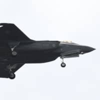 An Air Self-Defense Force F-35A fighter jet takes part in a military review at the Ground Self-Defense Force\'s Asaka training ground in Asaka, Saitama Prefecture, in October. | AFP-JIJI