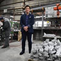 Sakae Casting Co. CEO Takashi Suzuki is seen at his firm’s aluminum casting plant in Tokyo’s Hachioji recently. | Yoshiaki Miura