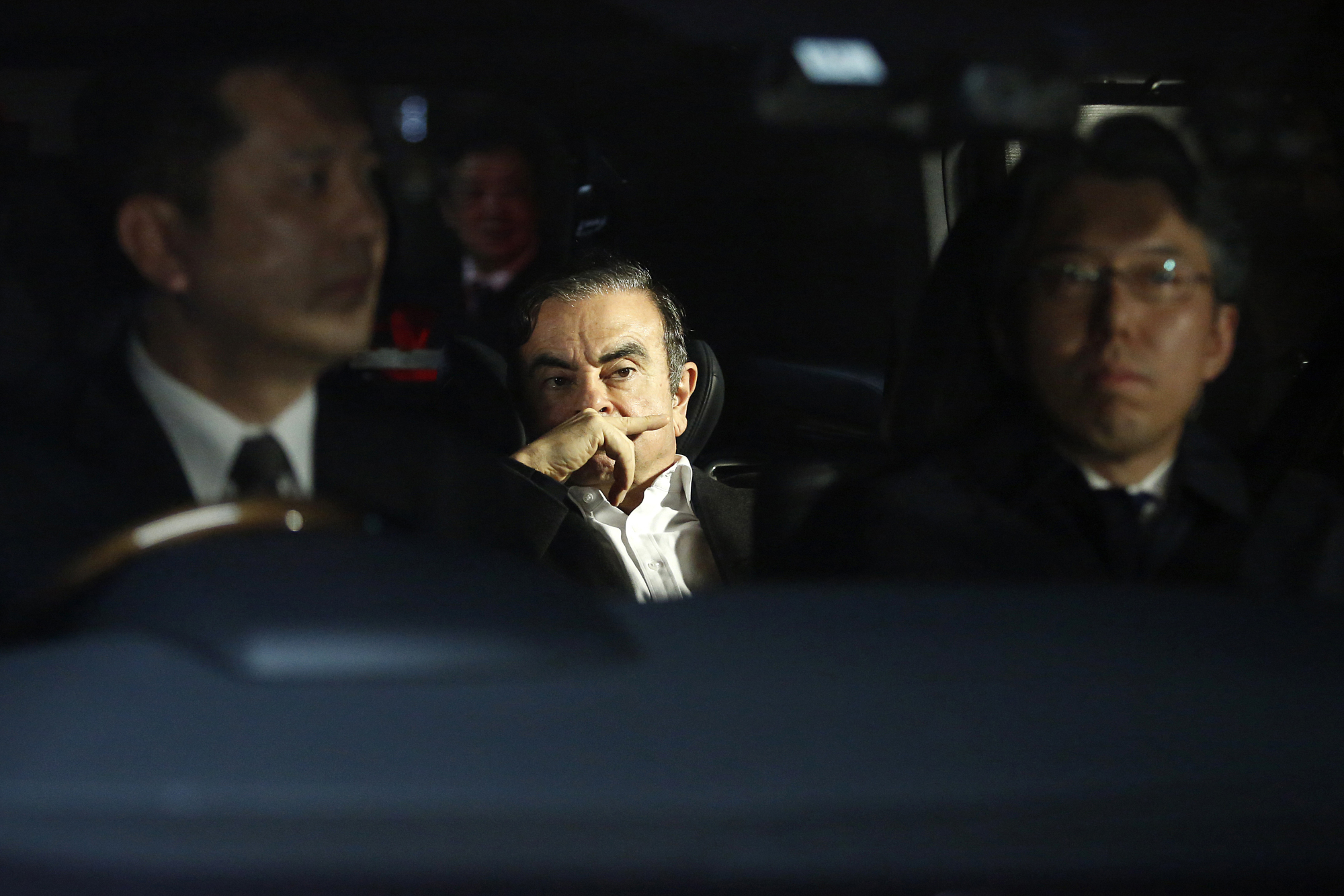 Carlos Ghosn, former chairman of Nissan Motor Co., leaves his lawyer's office in Tokyo on March 6 following his release from detention. He was rearrested April 4. | BLOOMBERG