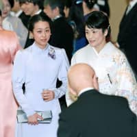 Vancouver Olympic figure-skating silver medalist Mao Asada and four-time Olympic wrestling champion Kaori Icho attend a tea party at the Imperial Palace in Tokyo hosted by Emperor Akihito and Empress Michiko on on Feb. 26 to mark the 30th anniversary of his enthronement. | POOL / VIA KYODO
