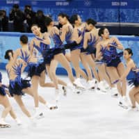 A time-elapsed photo shows figure skater Mao Asada performing a triple axel at the Sochi Olympics in February 2014. | KYODO