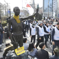 A controversial statue symbolizing wartime laborers is seen near the Japanese consulate in Busan, South Korea, in March. | KYODO