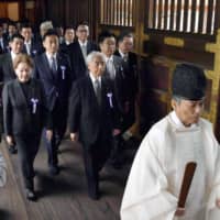 A cross-party group of lawmakers, headed by Hidehisa Otsuji of the Liberal Democratic Party, visits the controversial Yasukuni Shrine in Tokyo on Tuesday. | KYODO