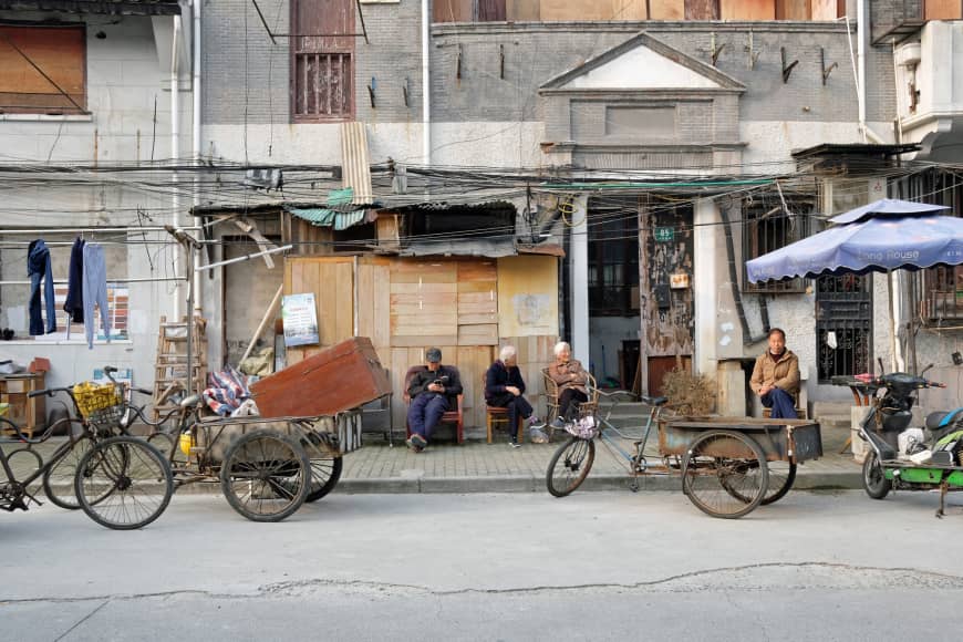 Shanghai hustle: Elderly residents of Shanghai sit out on the street in the shikumen (lane house) district of Xiaonanmen.