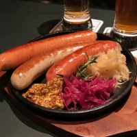New location, better wurst: Schmatz has over half a dozen sausages on its menu, alongside classic German bar foods and locally brewed craft beer. | ROBBIE SWINNERTON