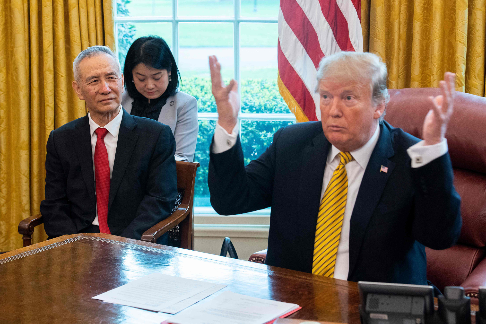 U.S. President Donald Trump speaks during a trade meeting with Chinese Vice Premier Liu He in the White House on April 4. Despite bilateral tensions, a majority of Chinese still hold a favorable view of the United States. | AFP-JIJI