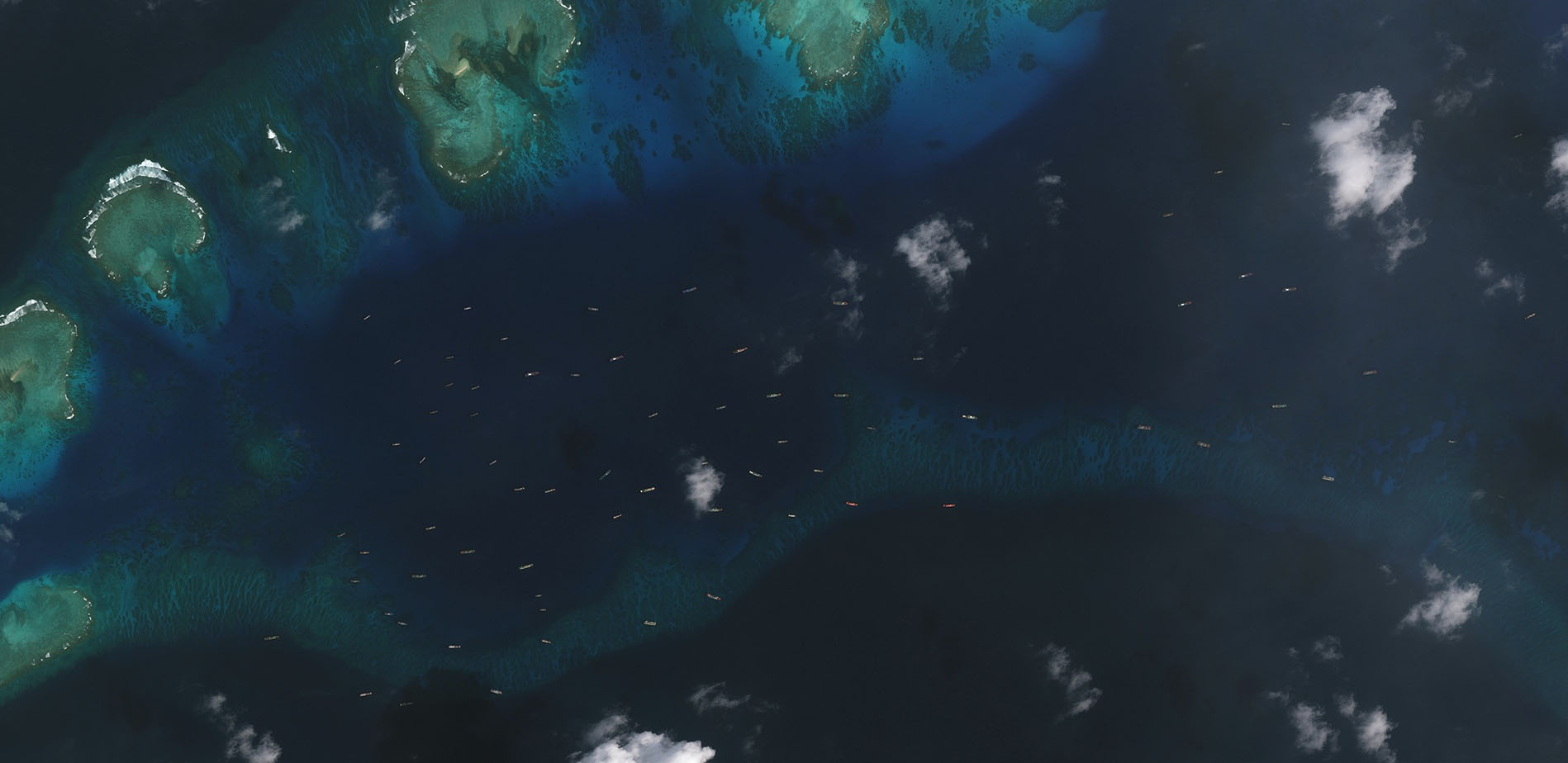 China’s maritime militia fleet is shown Dec. 20 deployed off disputed Thitu Island, which is occupied by the Philippines, in the South China Sea. | CSIS ASIA MARITIME TRANSPARENCY INITIATIVE / DIGITAL GLOBE