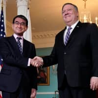 Foreign Minister Taro Kono is greeted by U.S. Secretary of State Mike Pompeo at the State Department in Washington on April 19 prior to holding bilateral security talks. | REUTERS