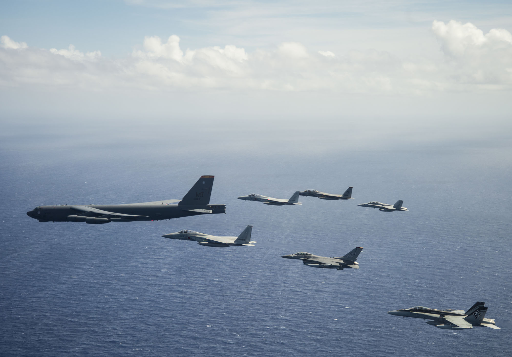 Aircraft from Japan, Australia and the United States fly in formation over the Pacific Ocean on March 6 during the COPE North 2019 multilateral military exercise. | 1ST COMBAT CAMERA SQUADRON