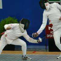 Former Ukrainian fencer Alexander Gorbachuk (right), seen in a July 2005 file photo, has been suspended from his job as the Japan men\'s epee coach for slapping a fencer. | AFP-JIJI