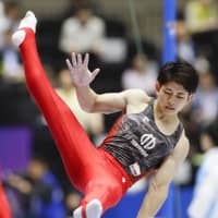 Kakeru Tanigawa competes on the pommel horse during the qualifiers for the men\'s all-around final at the national championships on Friday in Takasaki, Gunma Prefecture. Tanigawa, the reigning national champion, leads with 85.566 points. | KYODO