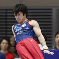 Kohei Uchimura competes on the pommel horse on Friday at the national championships. | KYODO