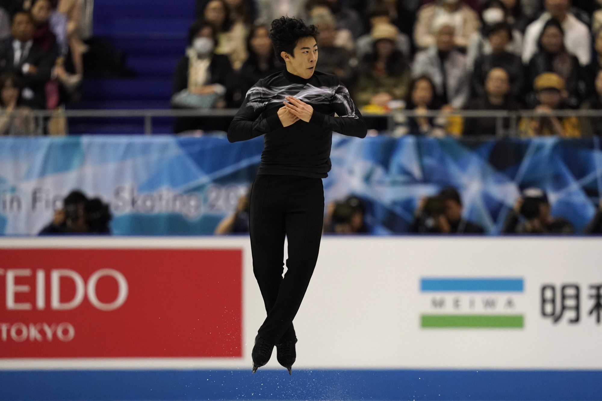 Nathan Chen competes in the free skate at the World Team Trophy on Friday in Fukuoka. Chen finished first in the two-day men's competition with 301.44 points. | AP