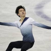 Vincent Zhou skates during the men\'s short program on Thursday. He sits in second place with 100.51 points, trailing only Nathan Chen. | AP