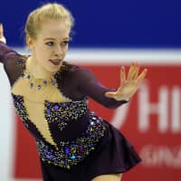 Bradie Tennell of the United States performs her women\'s free program routine on Saturday. Tennell earned a career-best score of 150.83 points with her second-place finish in the free skate. | AP