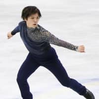 Shoma Uno skates to \"Winter in Four Seasons\" on Thursday. Uno is in third place after the men\'s short program with 92.78 points. | KYODO