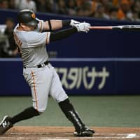 Giants slugger Christian Villanueva belts a solo home run in the ninth inning against the Dragons at Nagoya Dome on Tuesday. Villanueva hit a pair of homers in Yomiuri\'s 3-1 win. | KYODO