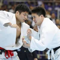 Hisayoshi Harasawa battles Kazuya Sato in the men\'s over-100-kg final at the National Invitational Weight Class Championships on Saturday at Fukuoka Kokusai Center. Harasawa won in extra time. | KYODO
