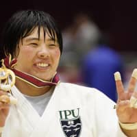 Akira Sone poses with her medal after capturing her second straight Japan women\'s national judo championship on Sunday in Yokohama. | KYODO