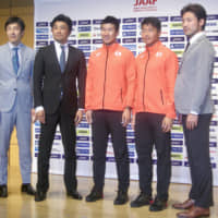 Yoshihide Kiryu (center), Yuki Koike (second from the right) and World Relays ambassadors pose for photos at a Tokyo news conference on Friday. | KAZ NAGATSUKA