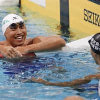 Shinri Shioura reacts after setting a new national record in the men\'s 50-meter freestyle at Tokyo\'s Tatsumi International Swimming Center on Sunday. | KYODO