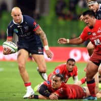 The Rebels\' Rebels Billy Meakes rumbles past the Sunwolves defense during a Super Rugby match on Saturday in Melbourne, Australia. | AFP-JIJI