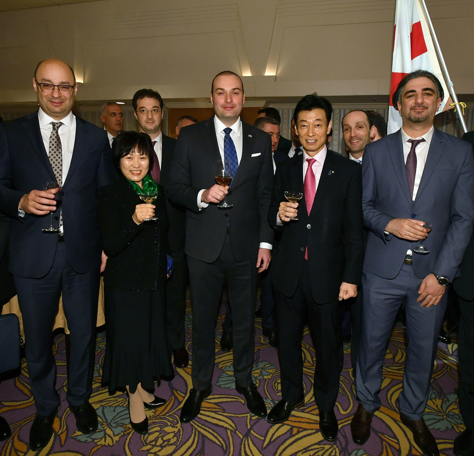 Georgian Prime Minister Mamuka Bakhtadze (center) attends a 