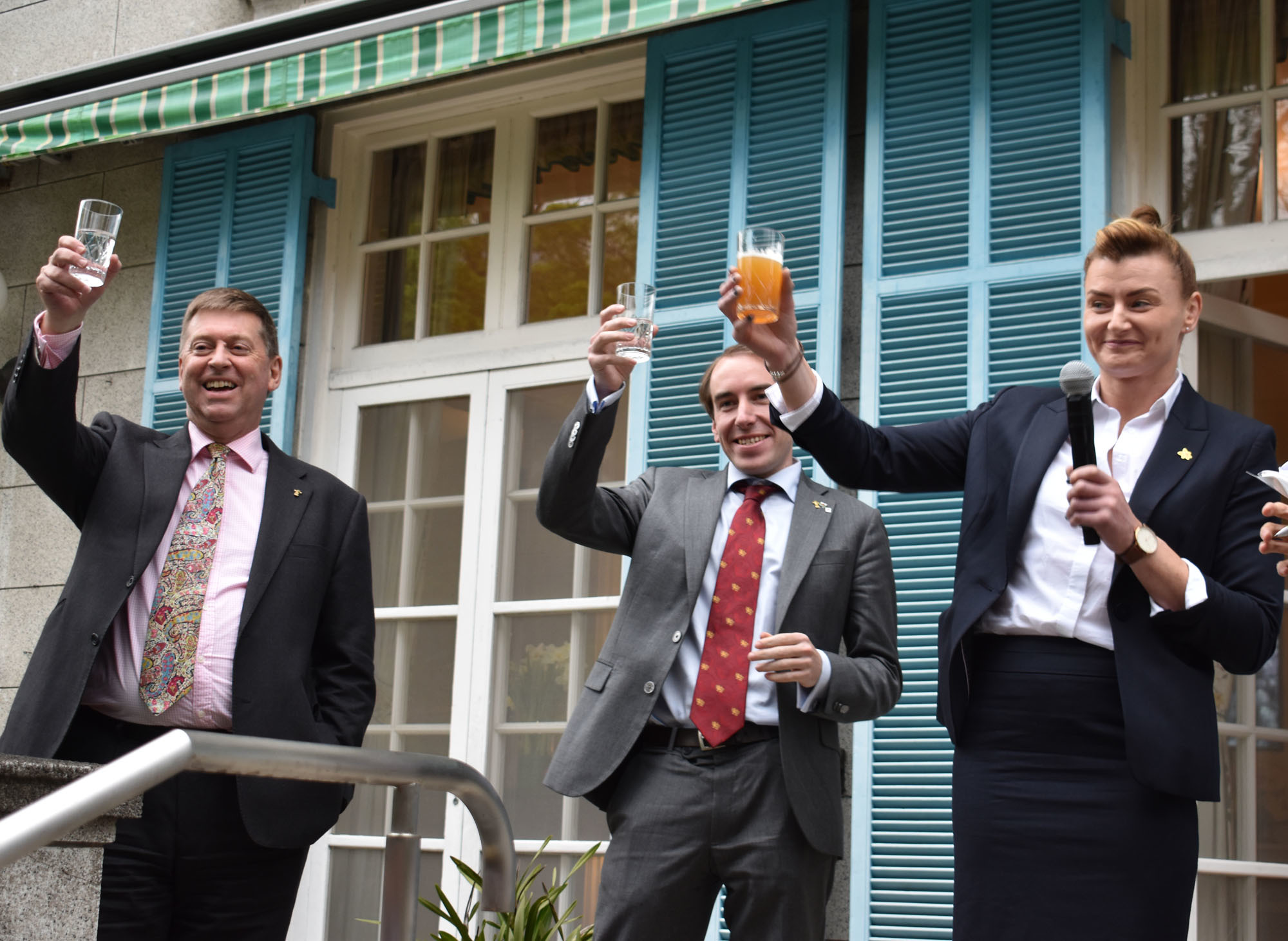 British Ambassador Paul Madden (left), Welsh Government Chief Representative Robin Walker (center) and Rachel Taylor, a former player on the Welsh women's national rugby team and Wales Rugby Union coordinator for the RGC West area, give a toast during a Welsh afternoon tea at the British Embassy on      March 28. satoko kawasaki | 
