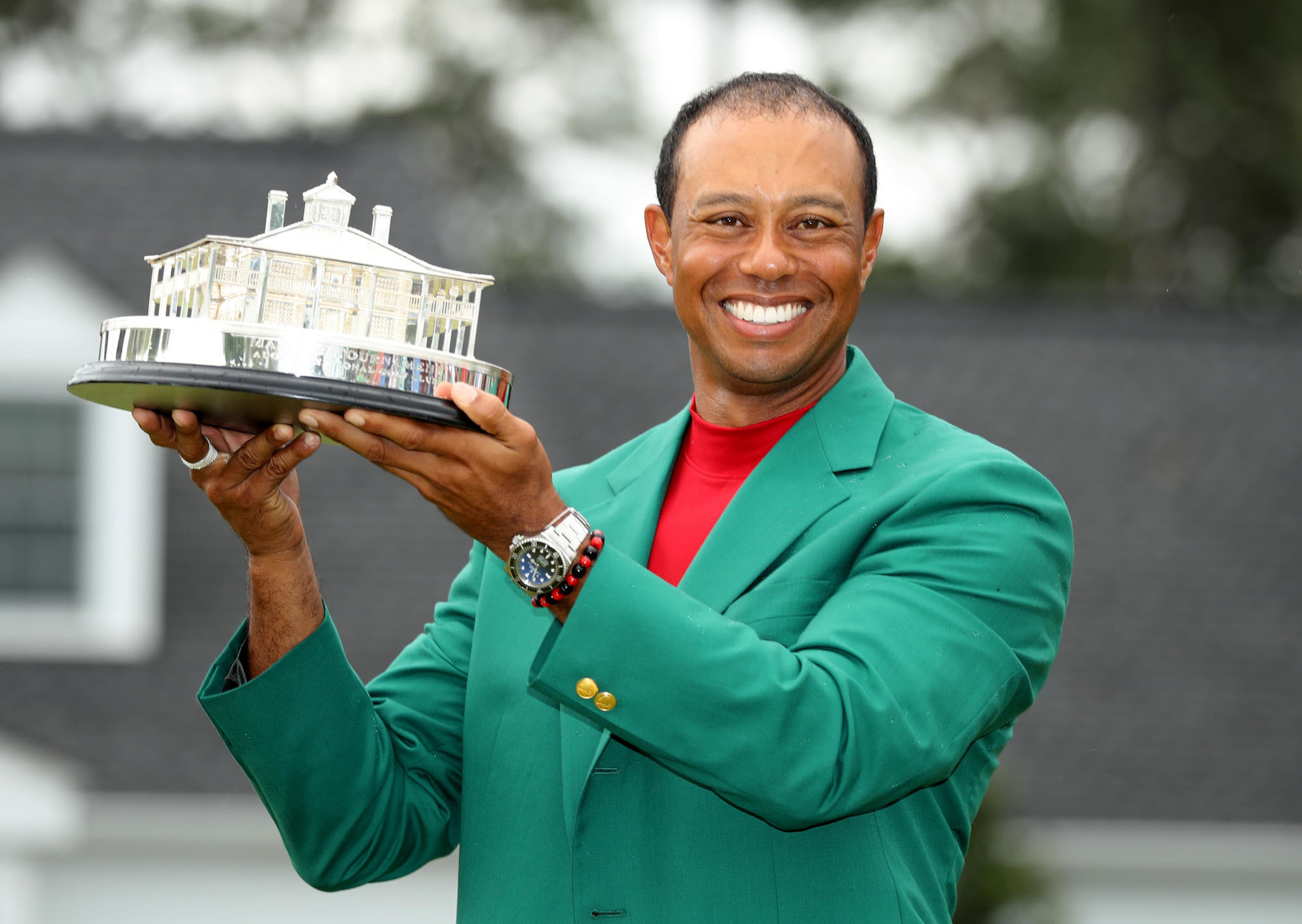Tiger Woods celebrates with his green jacket and trophy after winning the 2019 Masters on Sunday at Augusta National Golf Club in Augusta, Georgia. It was Woods' first major title in nearly 11 years and 15th overall, three short of Jack Nicklaus' record of 18. | REUTERS