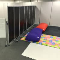 This 200-square-meter rental office room in Osaka\'s Minami district was offered to fathers and children who wished to rest while other members of their family were out shopping during Golden Week. | KYODO