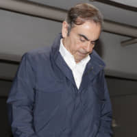Former Nissan Motor Co. Chairman Carlos Ghosn, who has been indicted in Japan for alleged financial misconduct, leaves a building in Tokyo that houses his lawyer\'s office on April 26, the day after his second release from the Tokyo Detention House on bail. | KYODO