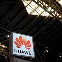 A Huawei company logo is seen at the security exhibition in Shanghai Friday. | REUTERS