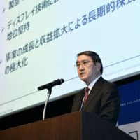Japan Display Inc. President Yoshiyuki Tsukizaki speaks at a news conference on April 12, when it was announced the company will receive a capital injection from a consortium including Chinese and Taiwanese firms. | KYODO