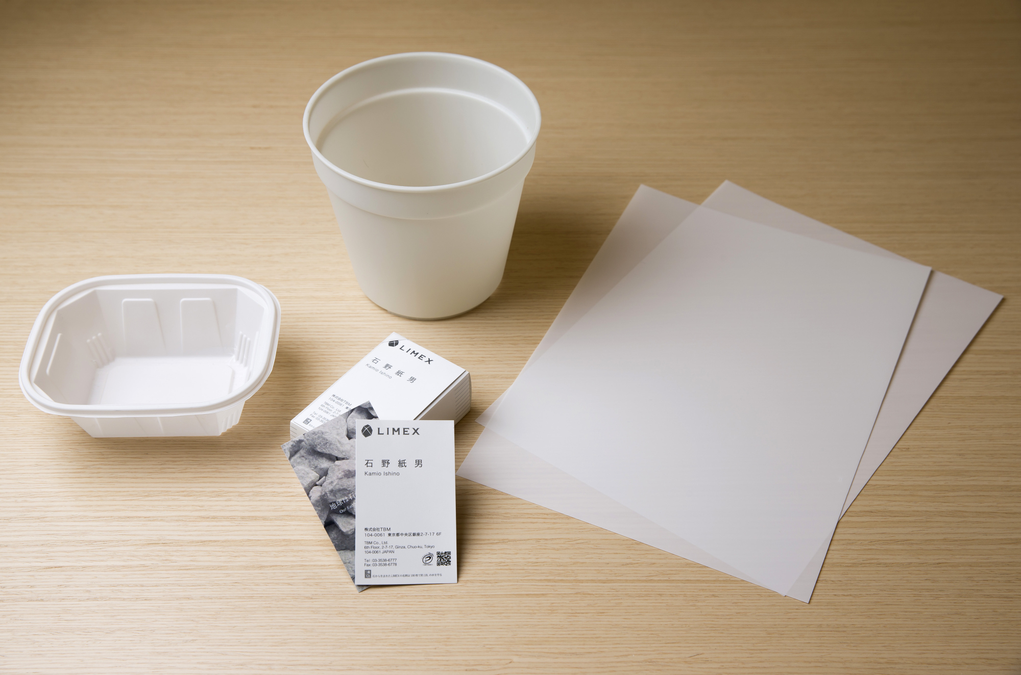 Business cards, plastic folders and food containers made from limestone are displayed at TBM Co.'s headquarters in Tokyo. | BLOOMBERG