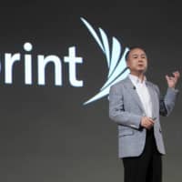 With a &#36;19 billion stake in Sprint Corp., SoftBank Group Corp., led by Masayoshi Son, will bear the brunt of the fallout if Sprint\'s takeover by T-Mobile US Inc. is blocked. | BLOOMBERG
