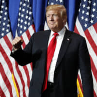 U.S. President Donald Trump addresses an audience at a trade show in Washington on Friday. | AP