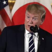 U.S. President Donald Trump addresses Japanese business leaders at the residence of  U.S. Ambassador William Hagerty following his arrival in Tokyo on Saturday. | AP