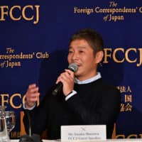 Japanese fashion tycoon Yusaku Maezawa speaks during a news conference in Tokyo on Oct. 9 last year. | YOSHIAKI MIURA