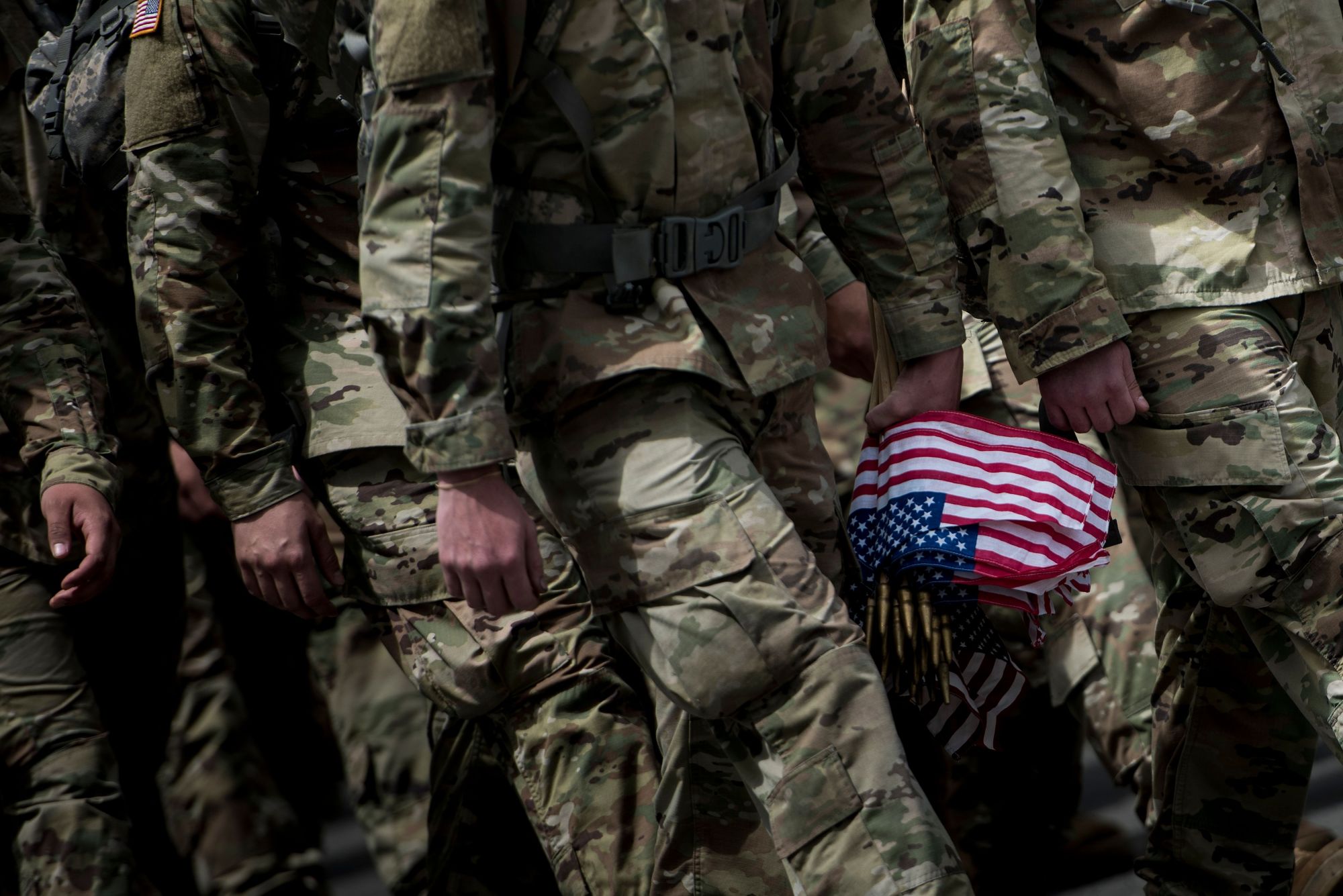 Soldiers in the Old Guard arrive to place U.S. flags at graves in Arlington National Cemetery in Arlington, Virginia, in 2017. Acting Defense Secretary Patrick Shanahan called for tougher action against sexual assault in the military Thursday after an annual Pentagon report said the number of assaults in 2018 had risen from recent years. | AFP-JIJI