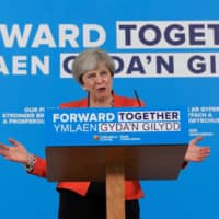 British Prime Minister Theresa May speaks at an election campaign event in Wrexham, Wales, Wednesday. | REUTERS