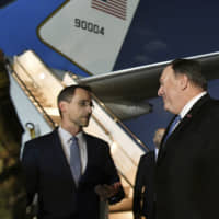 IU.S. Secretary of State Mike Pompeo (center) talks with Charge D\'affaires at the U.S. Embassy in Baghdad Joey Hood after he arrived for meetings May 7. A senior officer in the U.S.-led military coalition combating the Islamic State says there is no increased threat from Iranian-backed forces in Iraq or Syria. British Maj. Gen. Chris Ghika, speaking from coalition headquarters in Baghdad, made the remark to reporters at the Pentagon in a video teleconference Tuesday. | AP