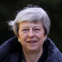 British Prime Minister Theresa May leaves church, as Brexit turmoil continues, in Sonning, England, on Sunday. | REUTERS