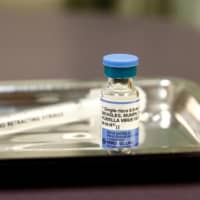 A vial of the measles, mumps and rubella (MMR) vaccine is seen in March at the International Community Health Services clinic in Seattle. | REUTERS