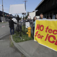 People asking Amazon.com to not sell face-recognition and other technology to federal government agencies, including Immigration and Customs Enforcement, demonstrate outside Amazon.com\'s annual shareholders meeting Wednesday in Seattle. | AP