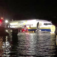 Authorities work at the scene of a plane that ended up in the water in Jacksonville, Florida, on Friday. | JACKSONVILLE SHERIFF\'S OFFICE / VIA AP