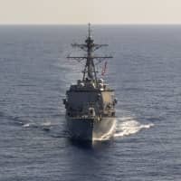 The guided-missile destroyer USS Preble steams through the Philippine Sea on April 18. | COMMANDER, TASK FORCE 70 / CARRIER STRIKE GROUP 5